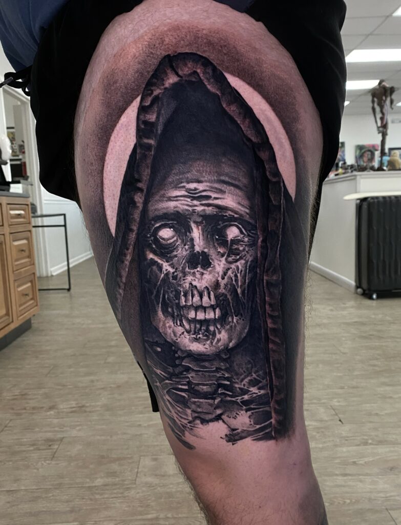 A Detailed Black and White Tattoo of a Skull