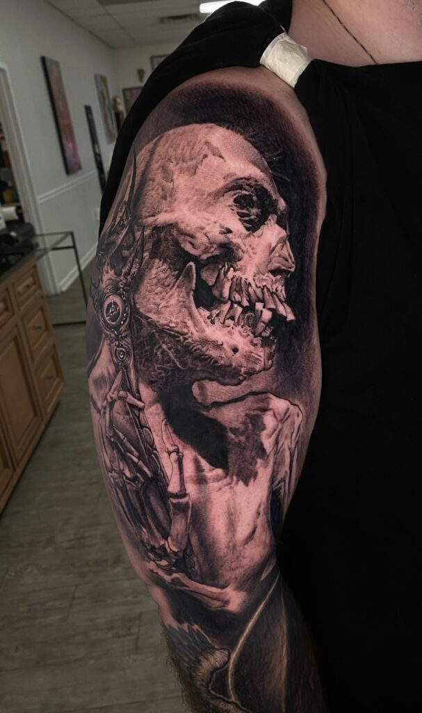 A Man Displaying a Tattoo of a Skeleton on His Arm