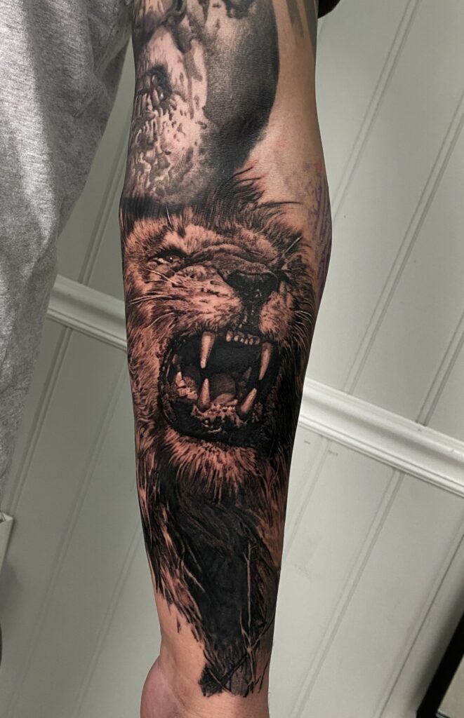 An Artistic Tattoo Featuring a Lion