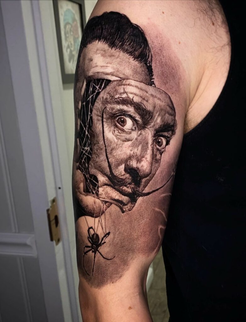 A Detailed Tattoo of a Man with a Spider on His Arm