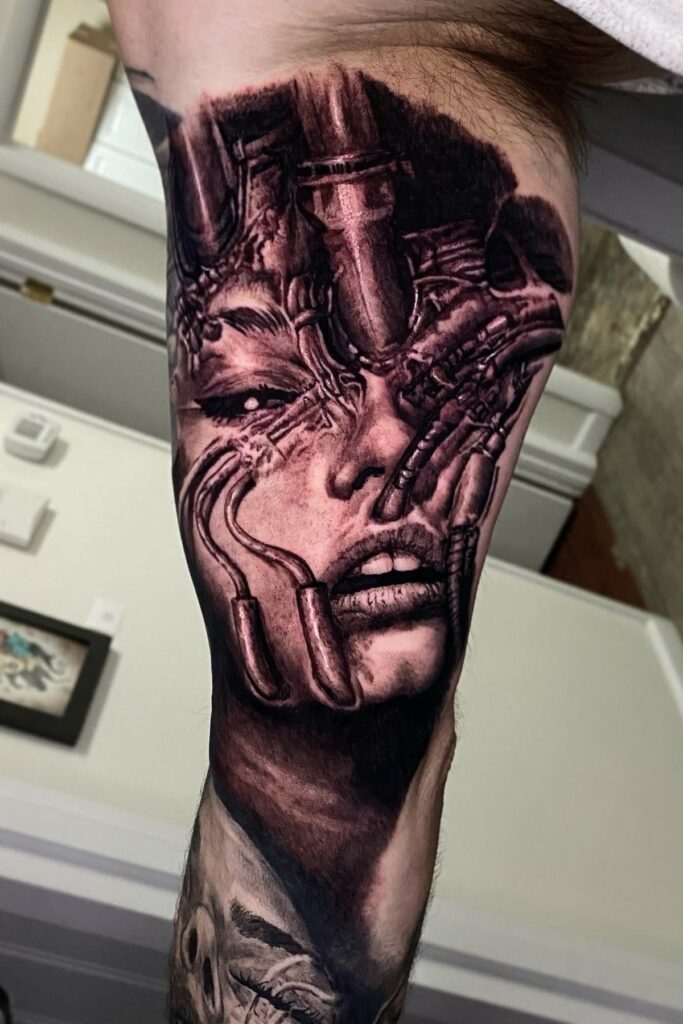 Tattoo Depicting a Woman with a Robotic Face Intricately Designed on Her Leg