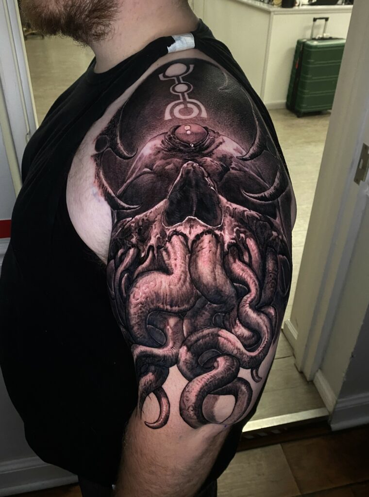 A Man Showcasing a Detailed Octopus Tattoo on His Arm