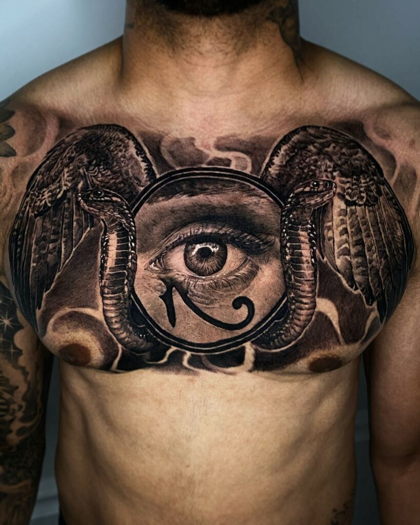 A Detailed Egyptian Eye Tattoo Prominently Displayed on a Person’s Chest