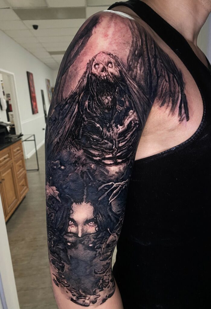 Man Showcasing a Tattoo of a Demon Intricately Designed on His Arm