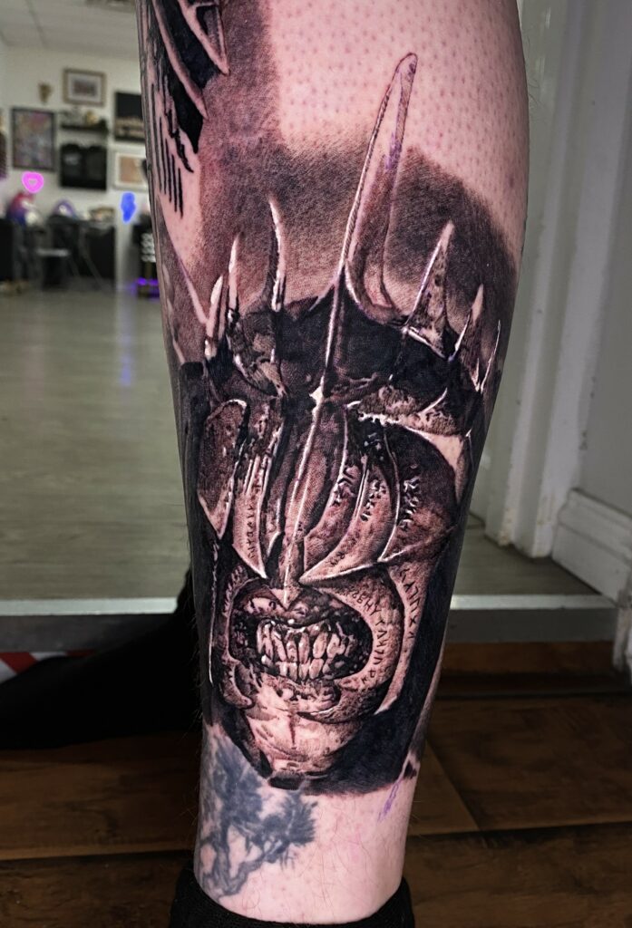 Detailed Tattoo of a Skull Adorned with Spikes