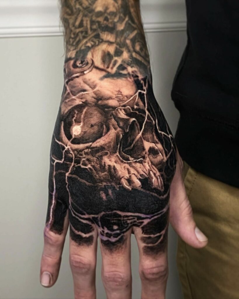 A Man Displays a Tattoo of a Skull on His Hand