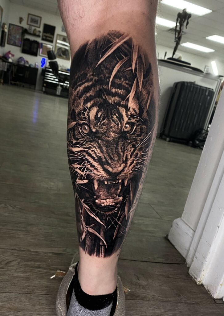 A Striking Tiger Tattoo Displayed on a Leg