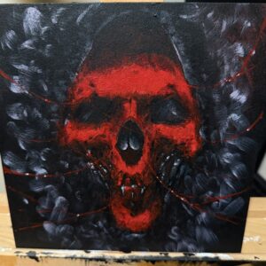A Striking Painting of a Skull Featuring Intense Red Eyes